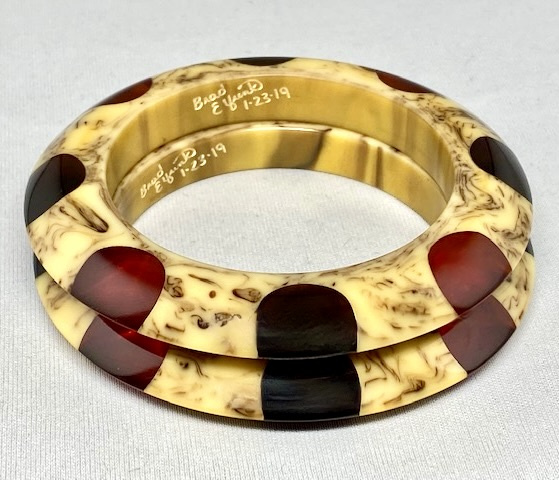 AB159 pair of Elfrink dotted saucer bakelite bangles