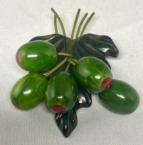 AB128 Moe stuffed olive bakelite charm pin