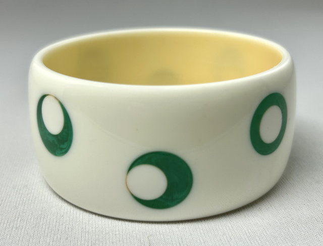 AP24 wide white with green googly eyed dots bakelite bangle